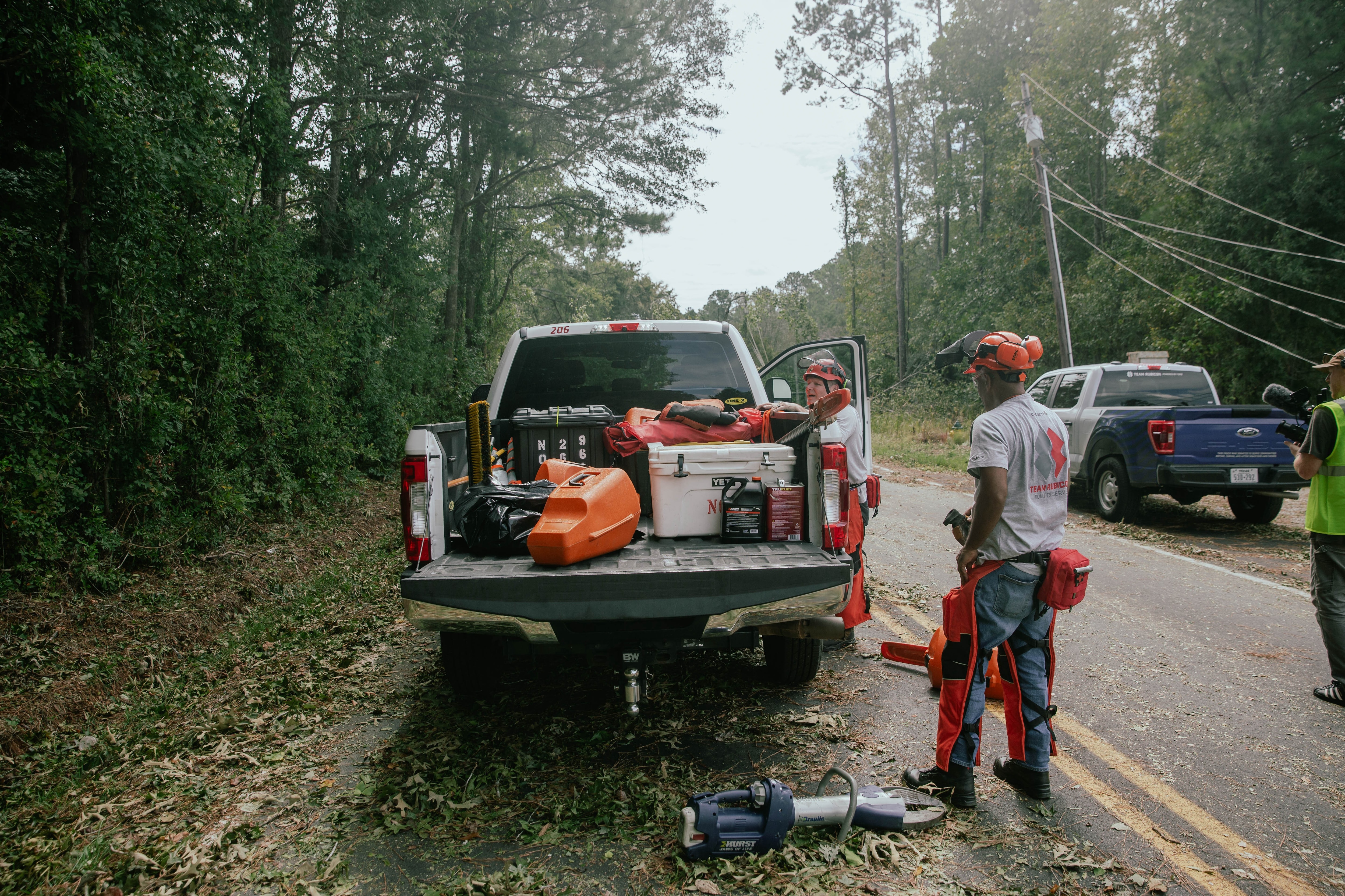 Volunteers help clean up after a hurricane.